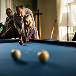 Family playing pool